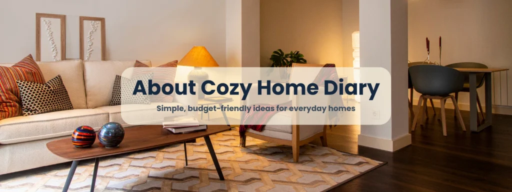 About Cozy Home Diary: a warm living room with a cream sofa, table lamp, wooden coffee table, and patterned rug